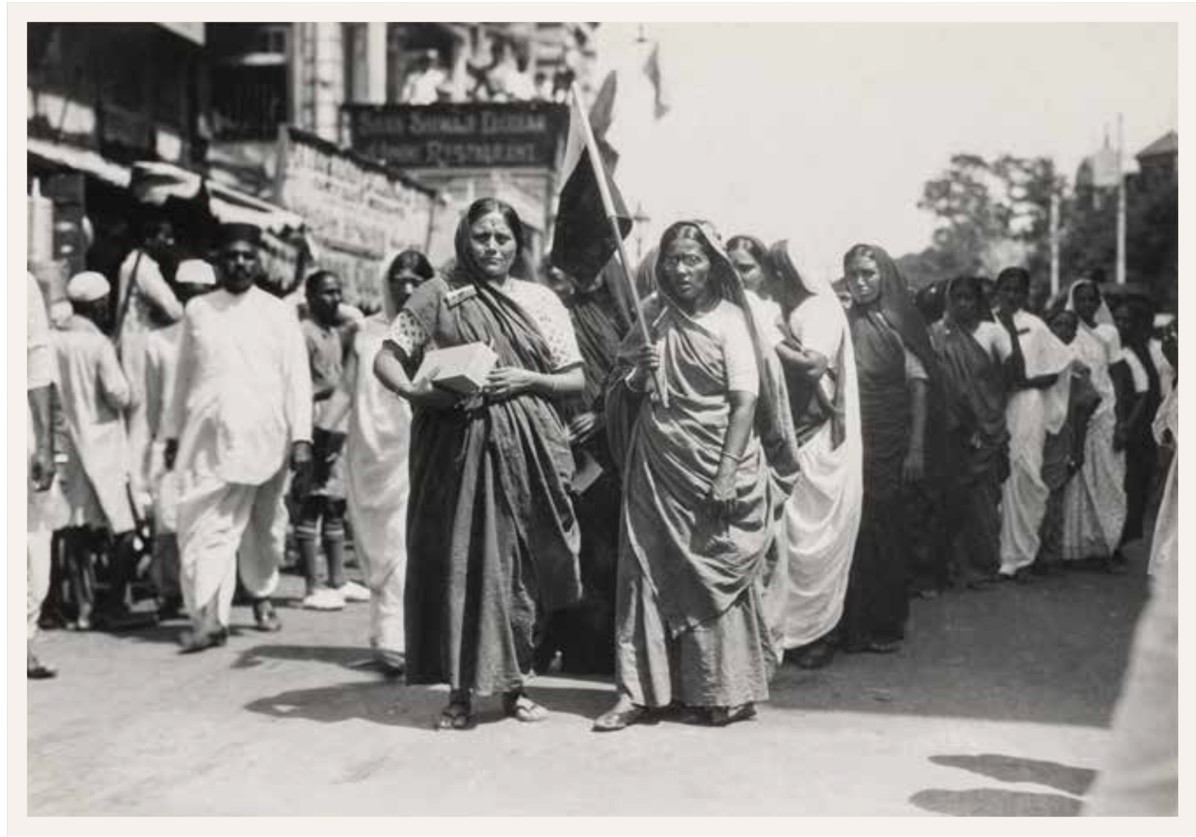 Women leading a boycott procession while holding the provisional national flag