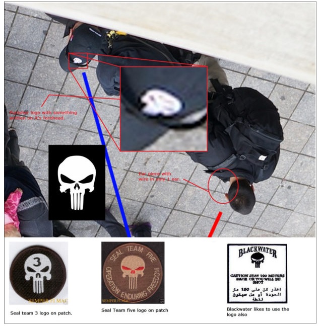 The same men dressed in black again, here the logo on one of their baseball caps is linked to the Navy Seals and Blackwater corporation logos The same men dressed in black again, here the logo on one of their baseball caps is linked to the Navy Seals and Blackwater corporation logos