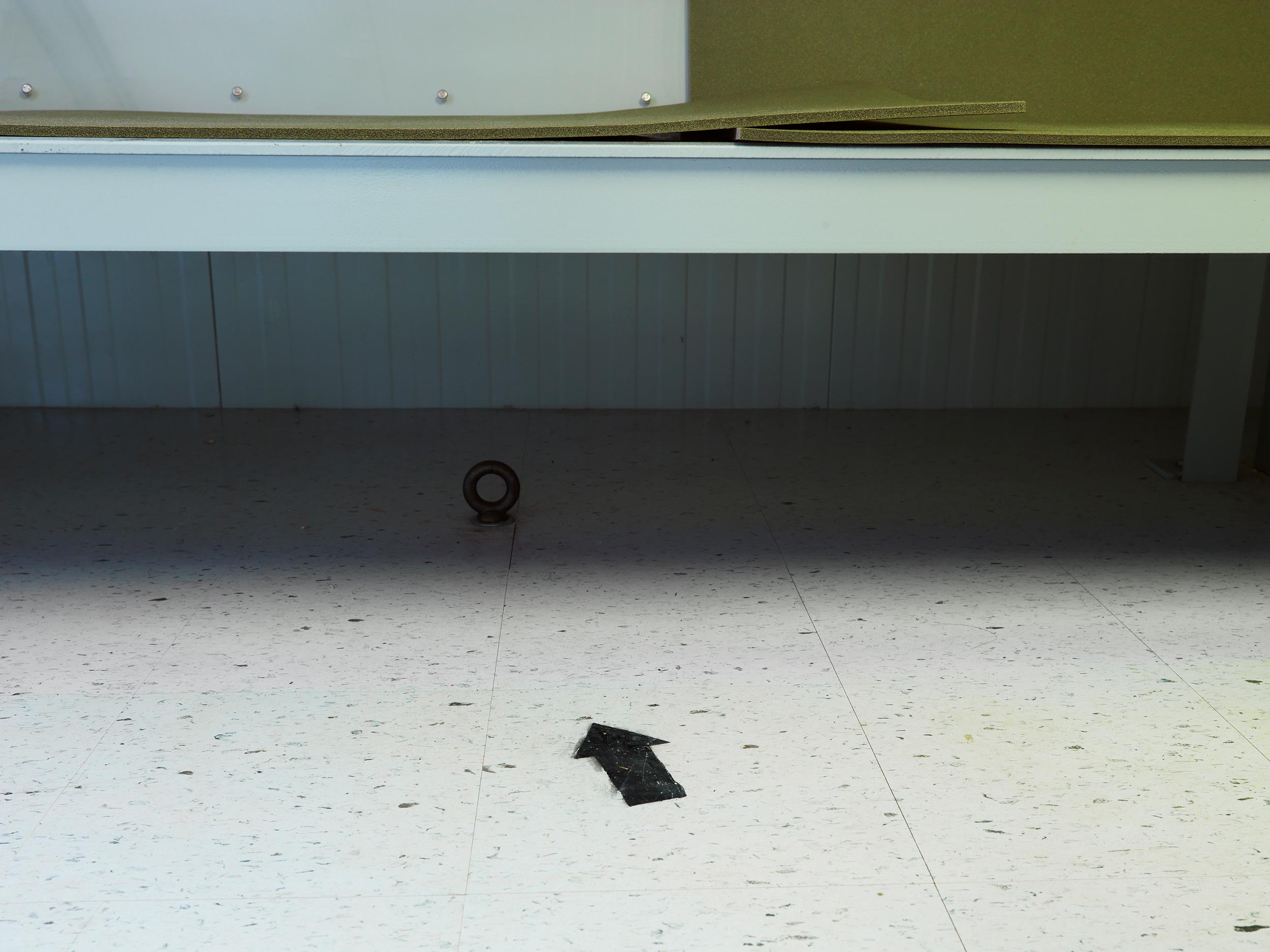 Edmund Clark, Camp 4, arrow to Mecca and ring for ankle shackles, from Guantanamo: If the Light Goes Out, 2010 Edmund Clark, Camp 4, arrow to Mecca and ring for ankle shackles, from Guantanamo: If the Light Goes Out, 2010