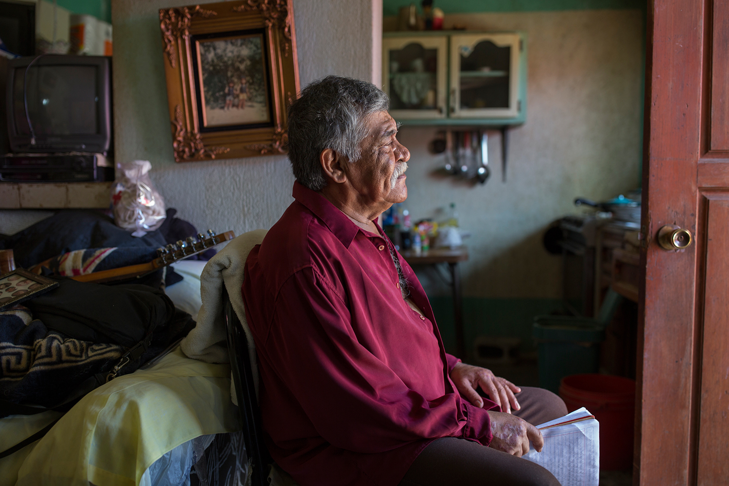 Musician Jose Marquez, who was deported from the United States in 2002, sits in his apartment in Tijuana, Mexico composing a song for his daughter’s wedding. © Griselda San Martin Musician Jose Marquez, who was deported from the United States in 2002, sits in his apartment in Tijuana, Mexico composing a song for his daughter’s wedding. © Griselda San Martin