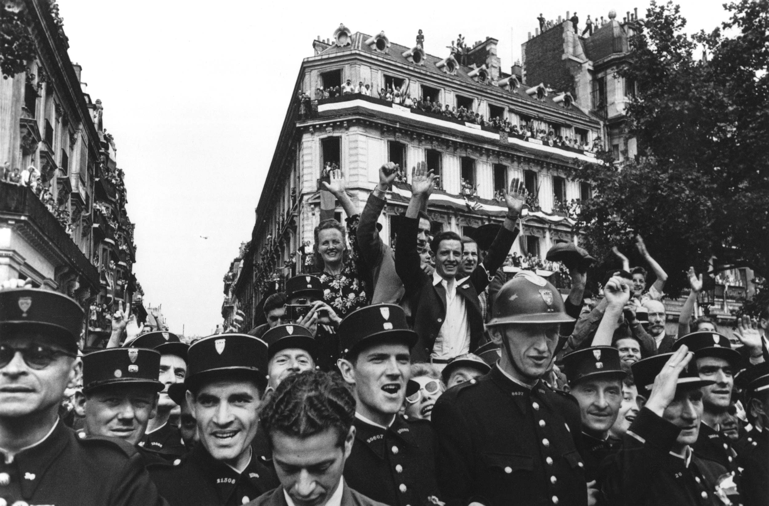 Robert Capa, Crowds fill up the Champs-Élysées to celebrate the liberation of Paris, Paris, France, August 26, 1944. © International Center of Photography/Magnum Photos