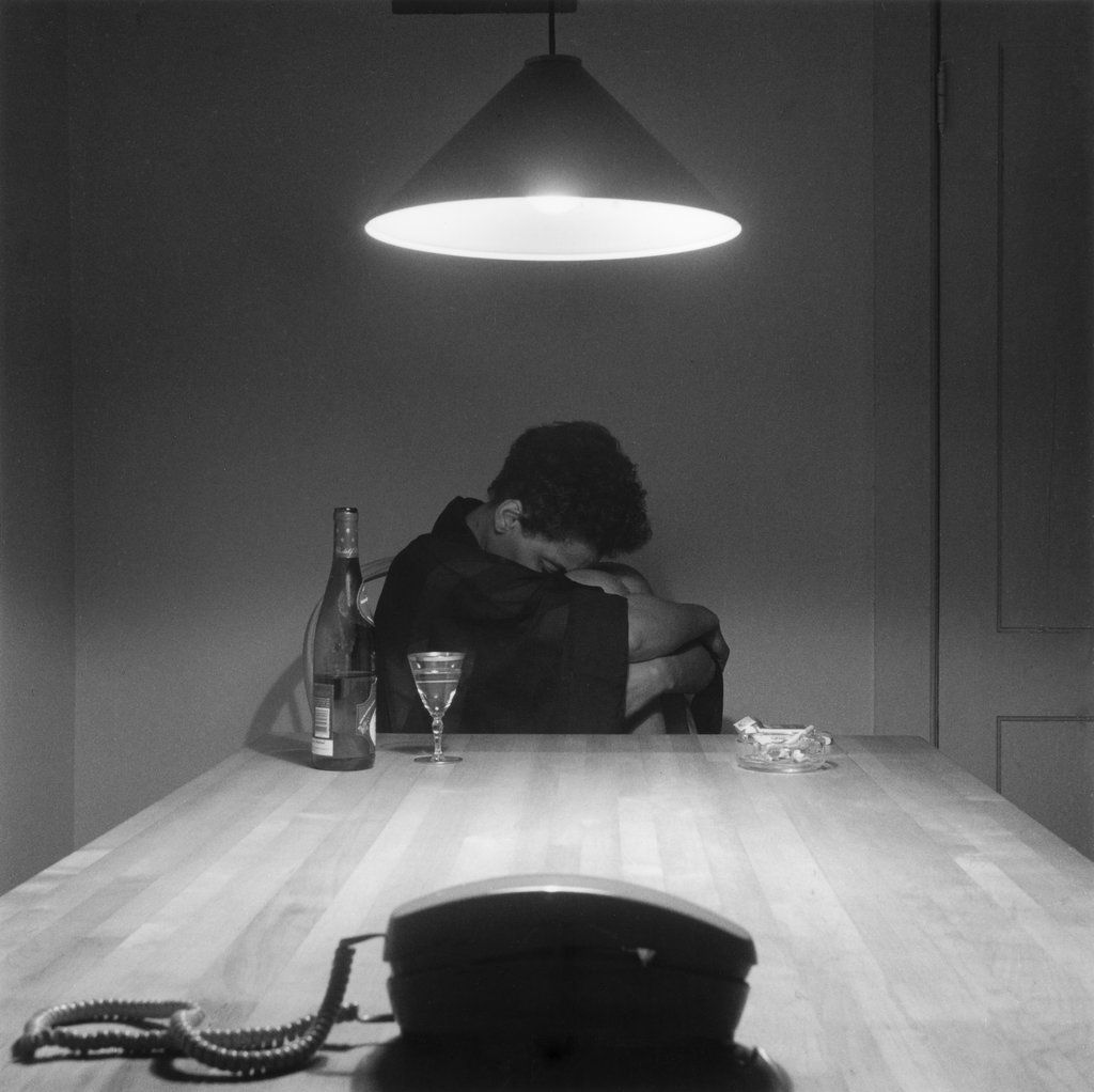 From the "Kitchen Table Series" by Carrie Mae Weems. Carrie Mae Weems. Untitled (Woman and phone), 1990.