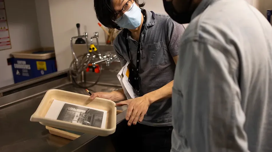 two people in ICP darkroom