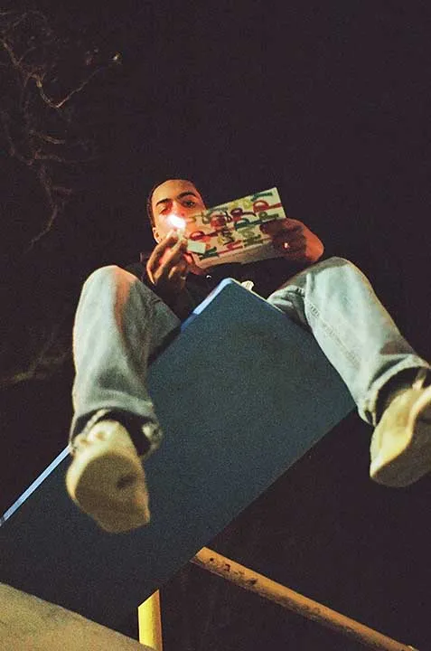 A person burning a book.