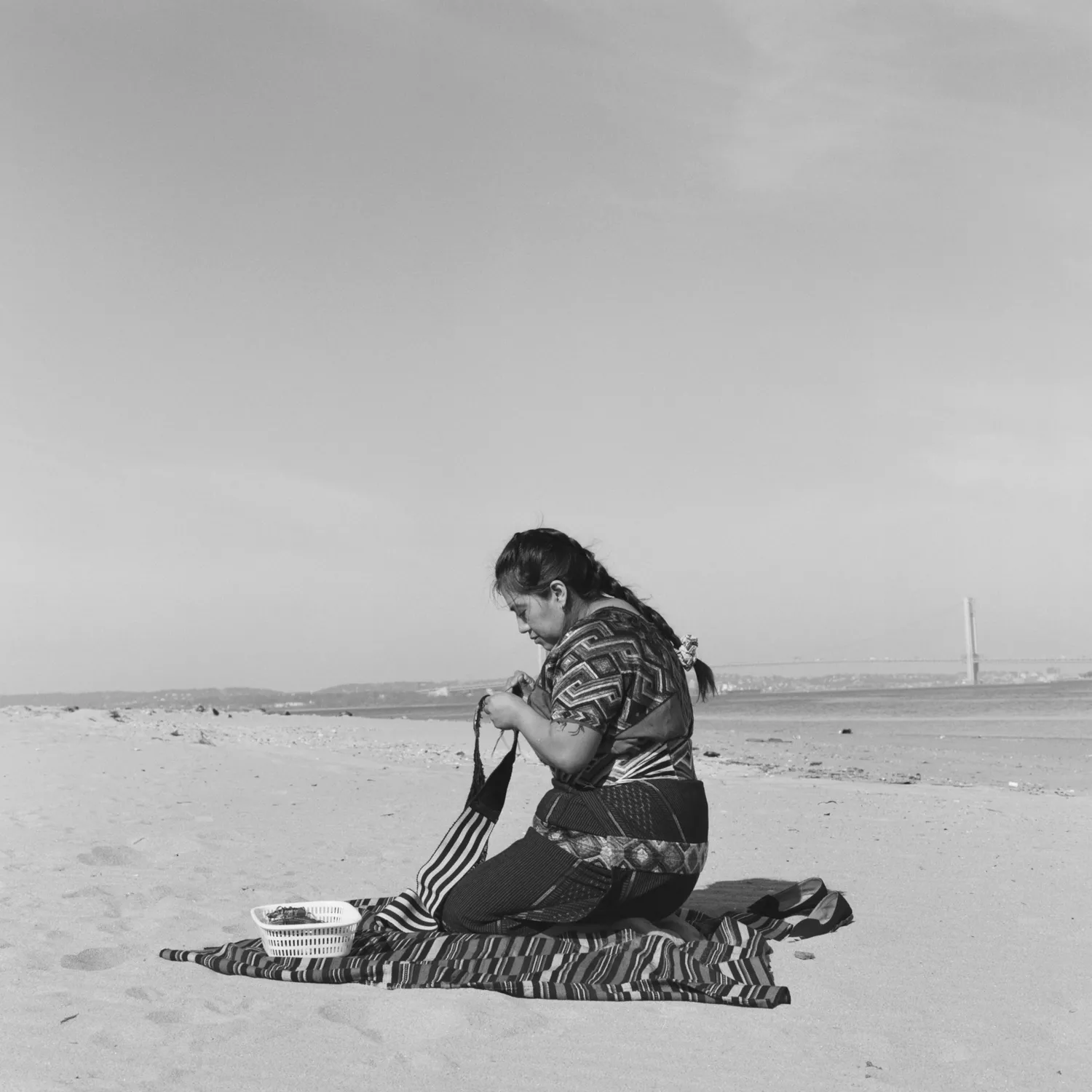 Woman kneeling on a beach