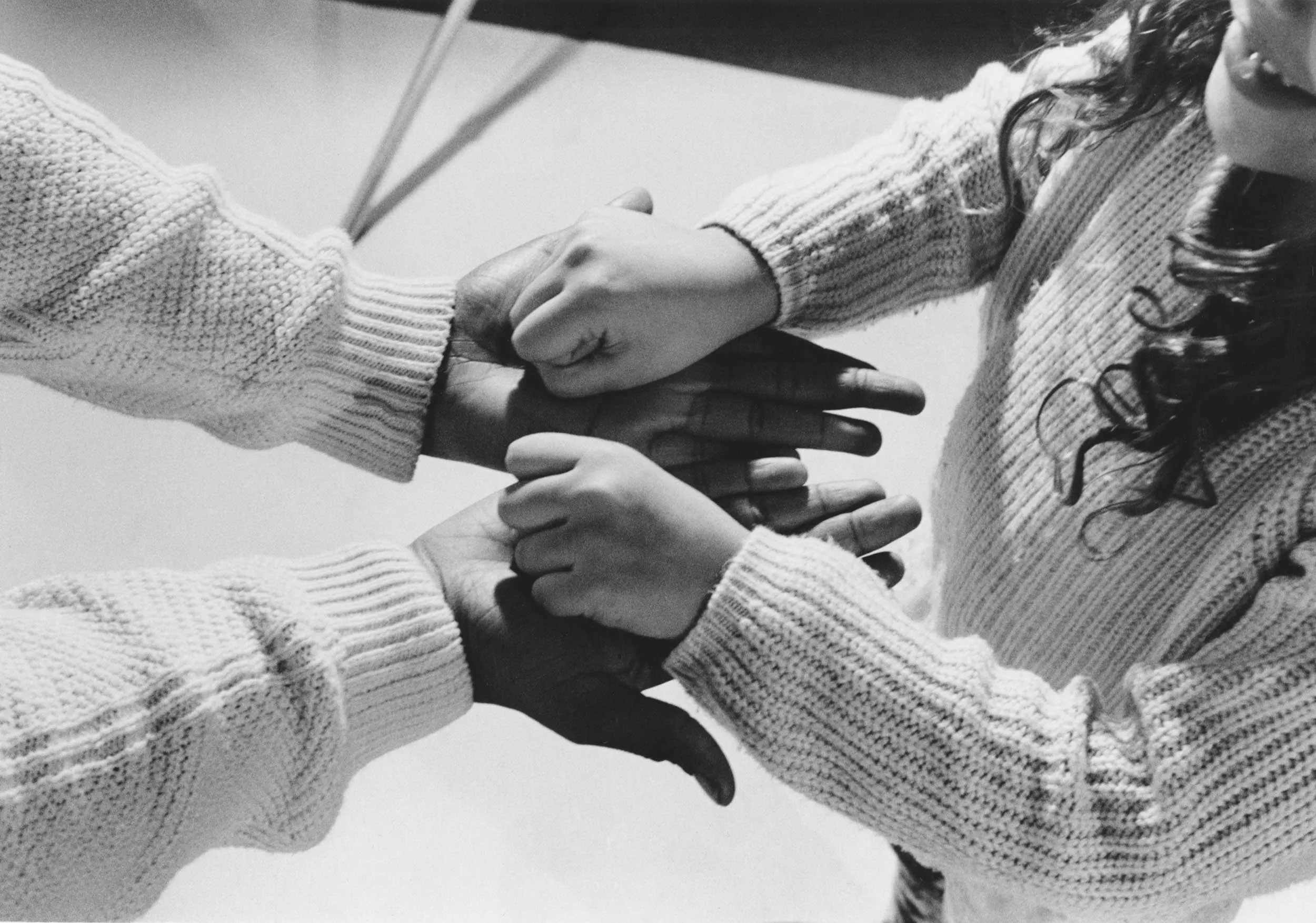 Two hands holding each other.