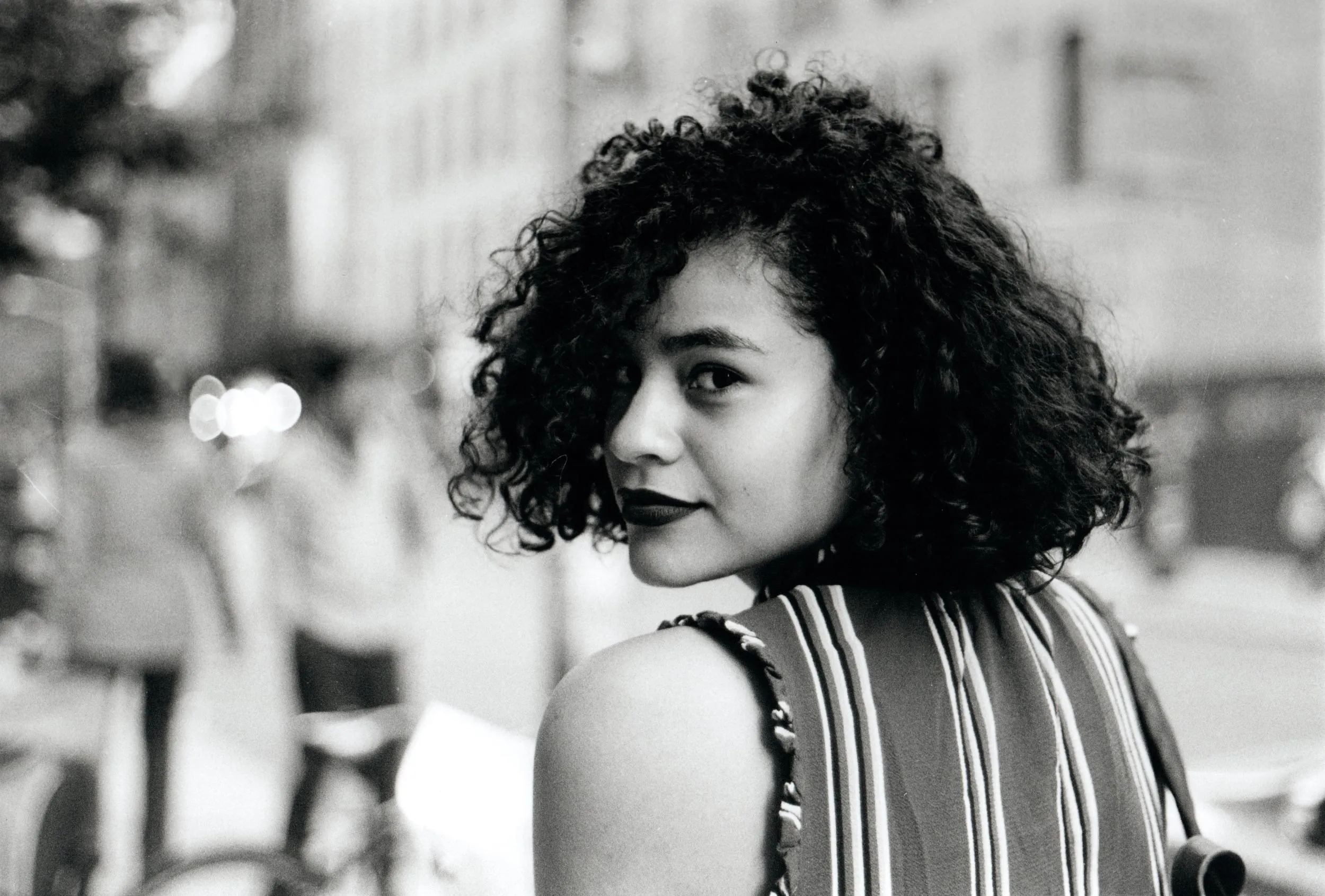 Black and white image of a lady looking back
