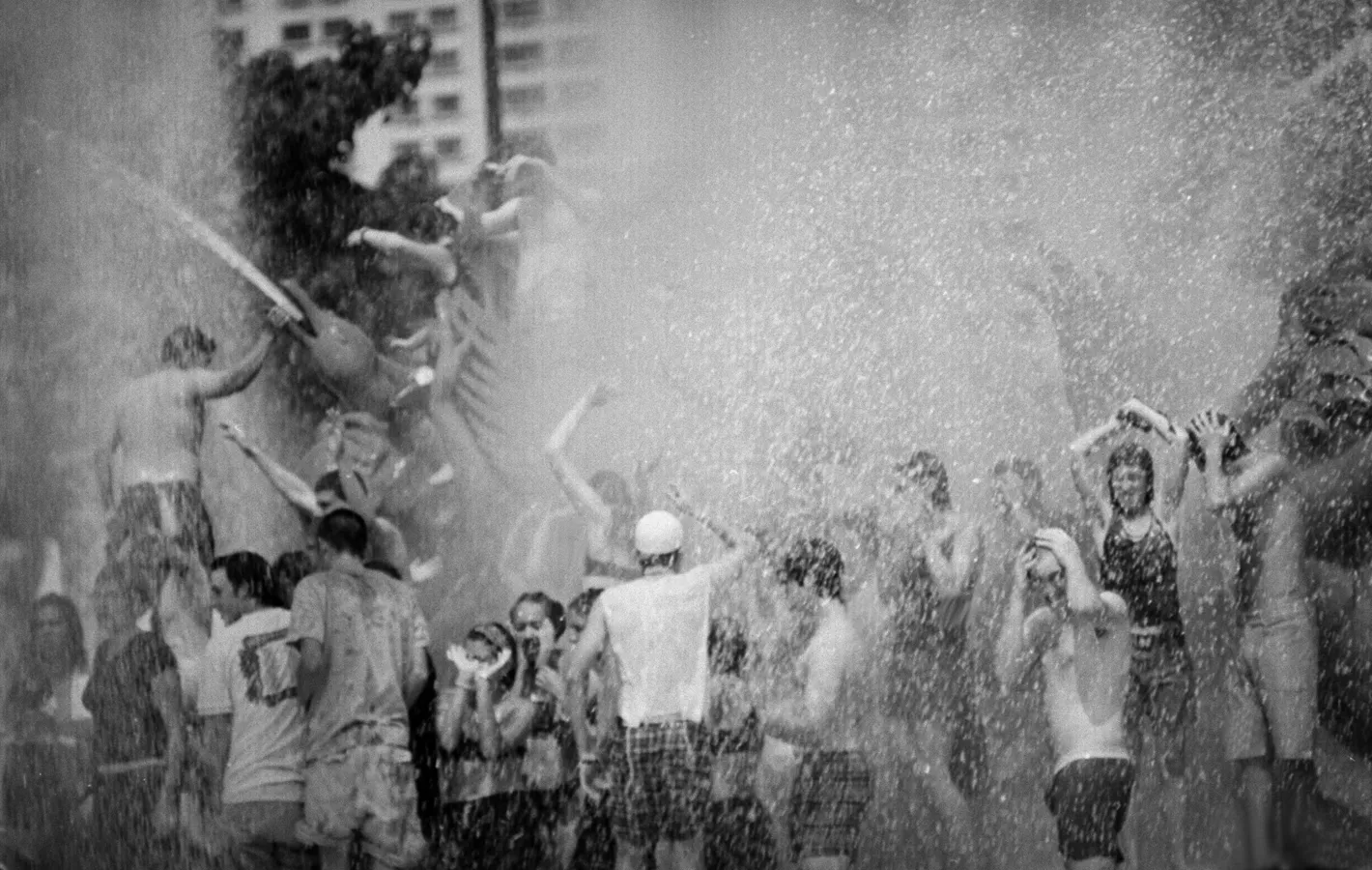 People outside playing with water.