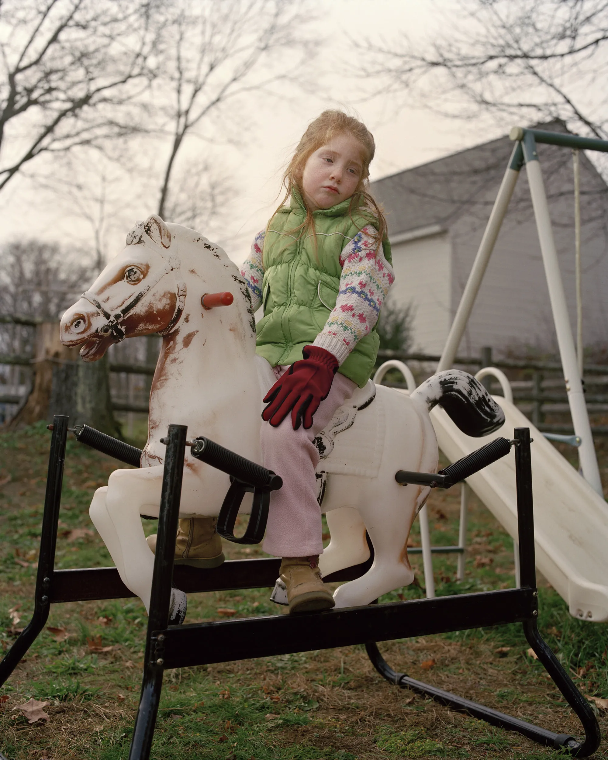 A little girl in a playground.