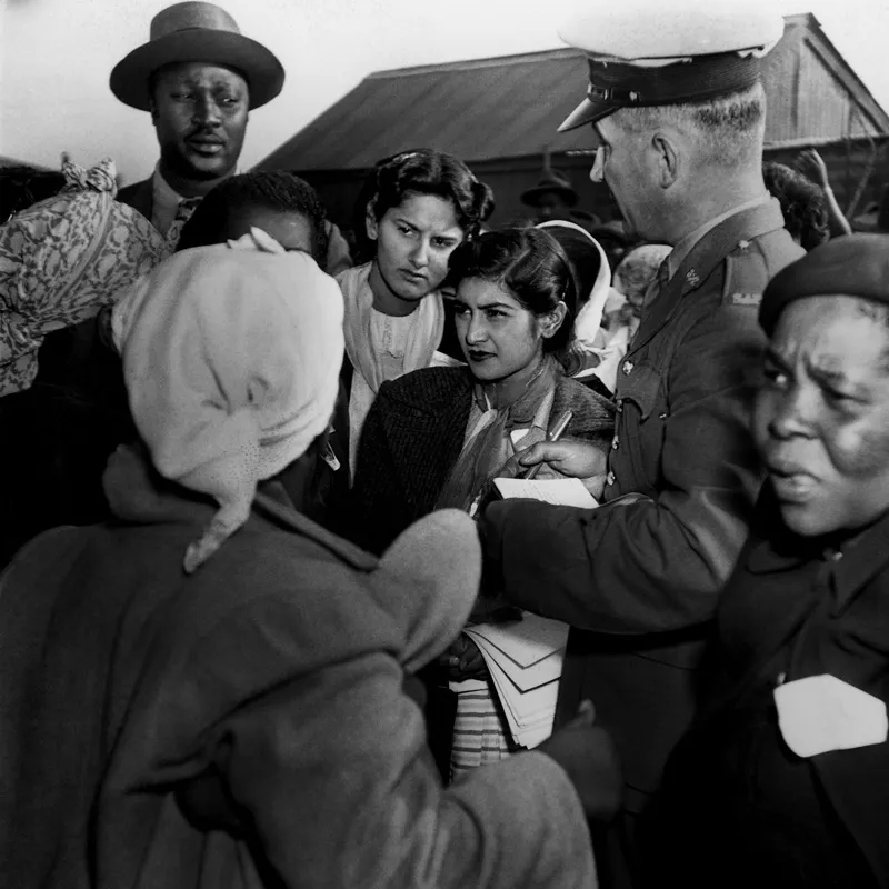 A group of people talking to the police.