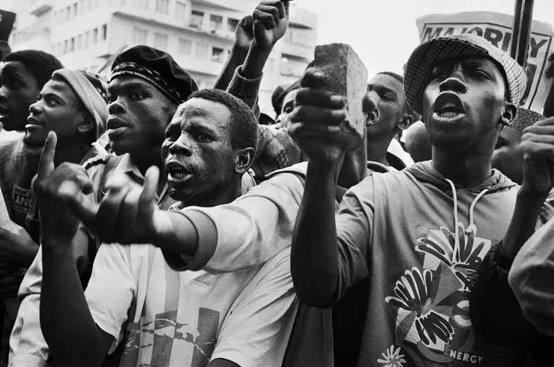 A picture of people protesting and yelling.