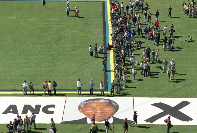 A group of people outside on a field.