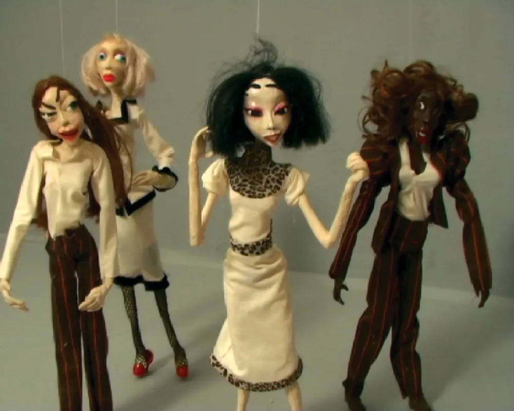 Four standing dolls.