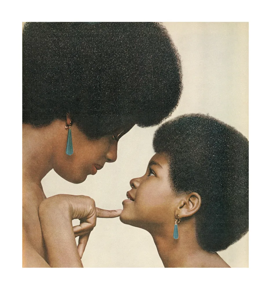 A young girl looking up to a women.