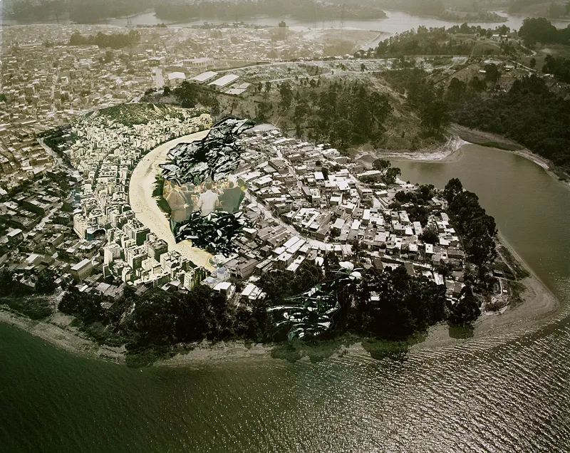 A cityscape on a peninsula as seen from high above the water. 