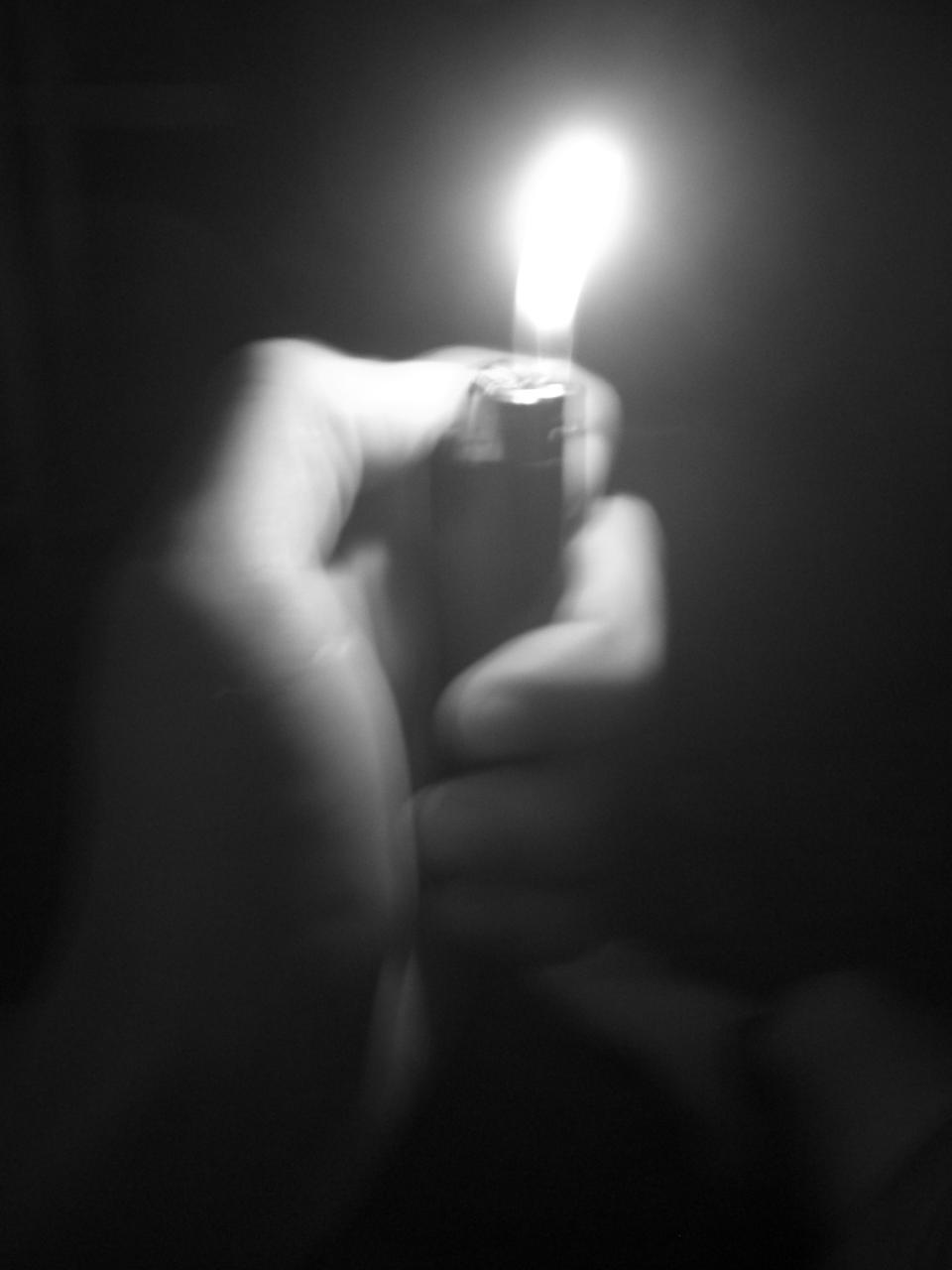 A photo of a lighter being lit.