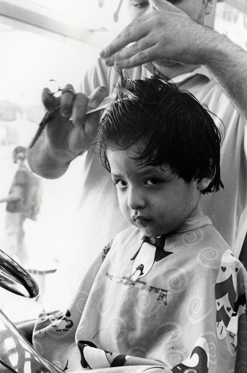 A child getting a haircut.