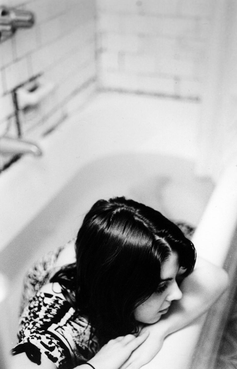 A woman in a bathtub.
