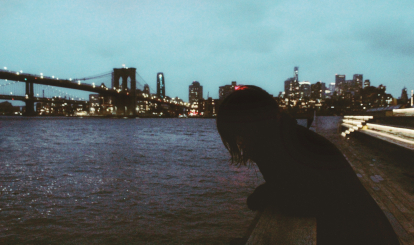 A person leaning against the rail.