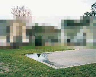 A picture of the suburbs with a pixelated house.