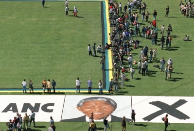 A group of people outside on a field.