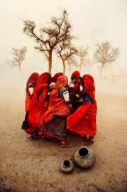 A group of women huddled up outside