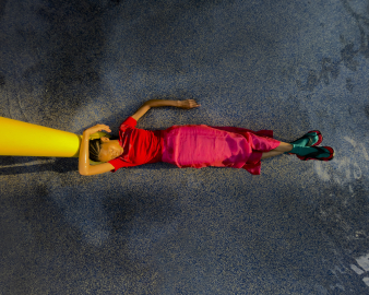 A woman laying on the floor.