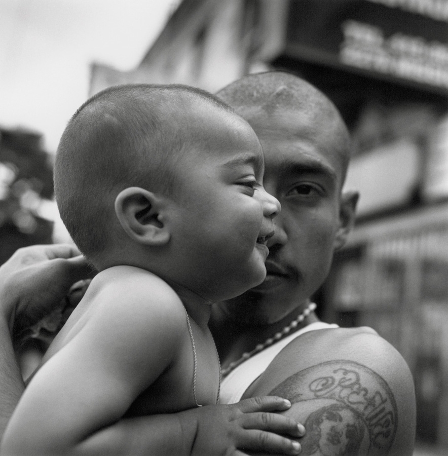 A man holding a baby.