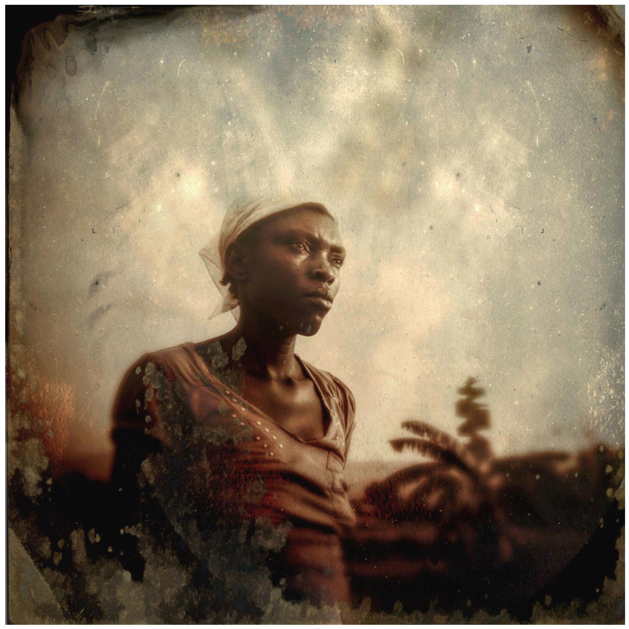 An old portrait of a woman outside.