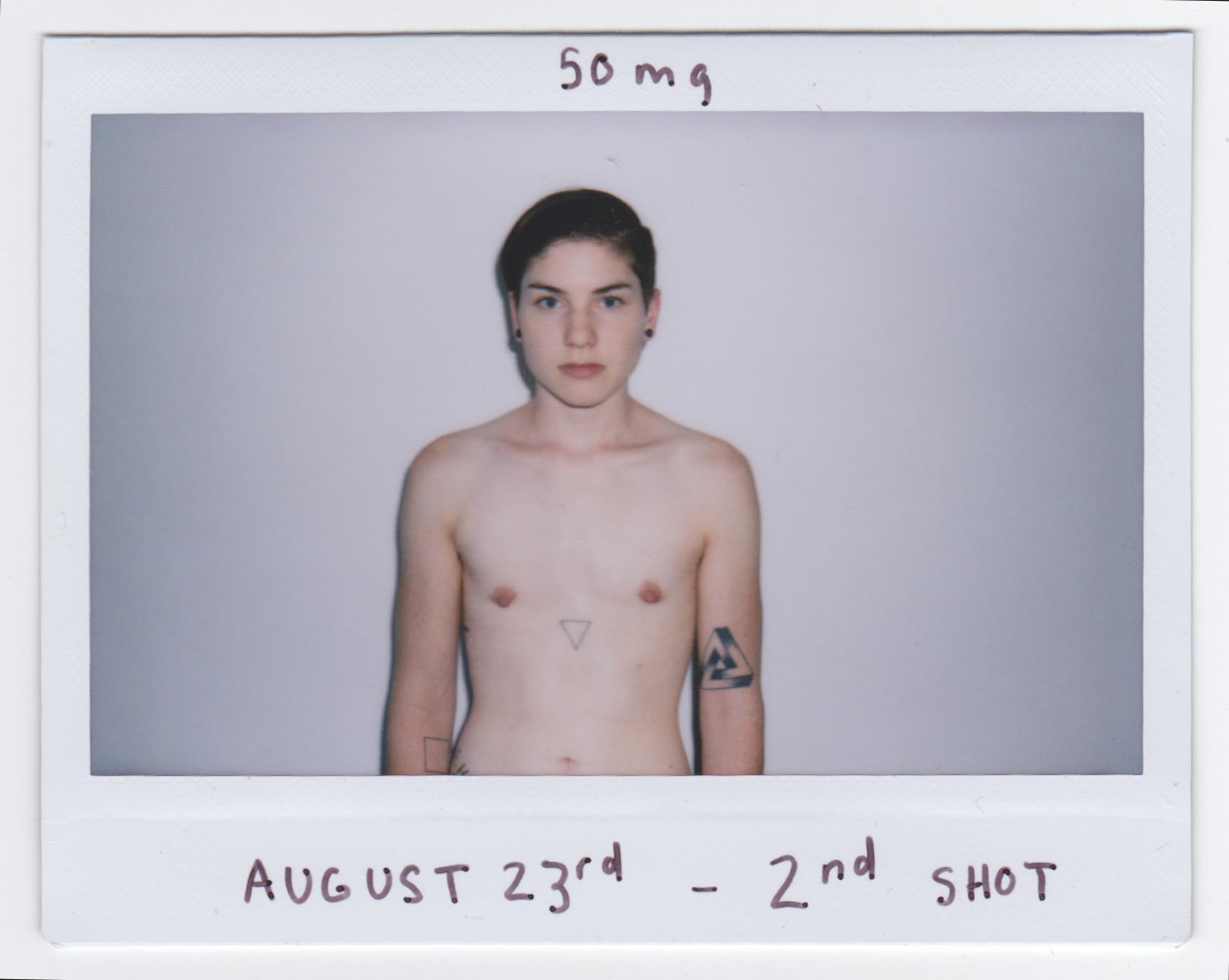 A polaroid of a shirtless man.