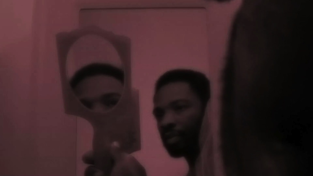 A person holding a mirror.