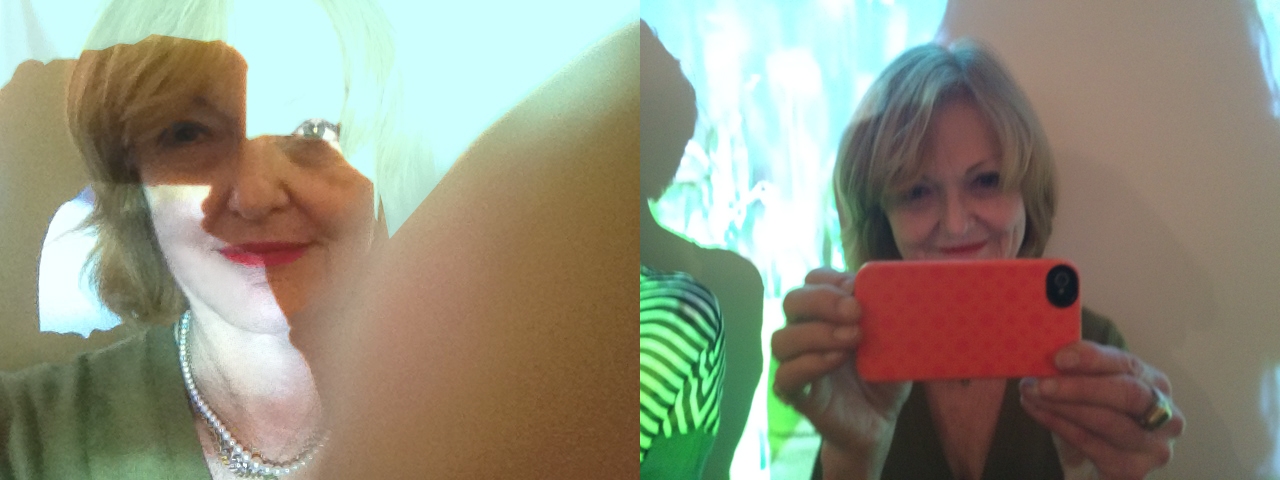 A girl taking a picture with their phone.