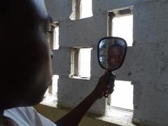A person looking in the mirror.