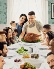 A family dinner with a huge turkey.