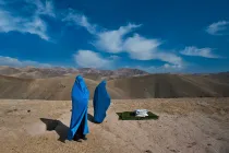 Two people standing outside.