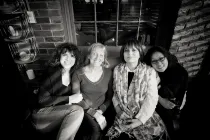 Four women sitting down.