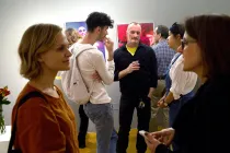 A group of people at an art exhibition.