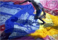 A person jumping on colorful floor.