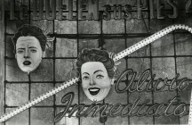 Two faces on a billboard.