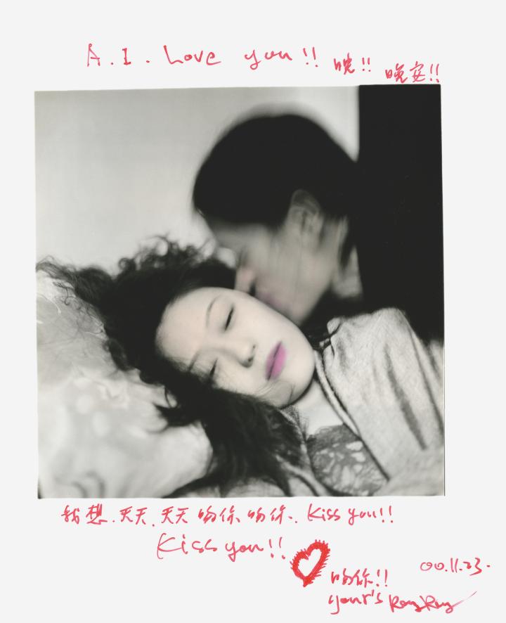 A polaroid of a blurry individual in motion kissing a woman who is still with her eyes closed. 