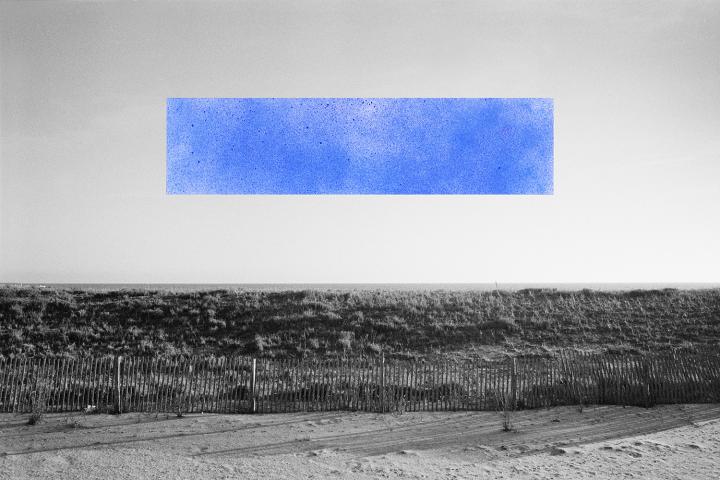 A blue strip against a black and white landscape