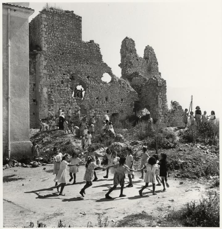 Kids playing in ruins. 