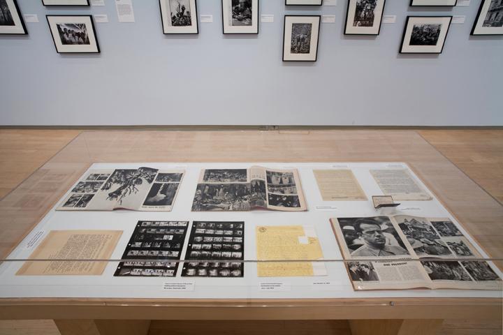 A display case of writings and photography negatives. 