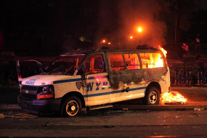 The burnt out remains of an NYPD police van. 