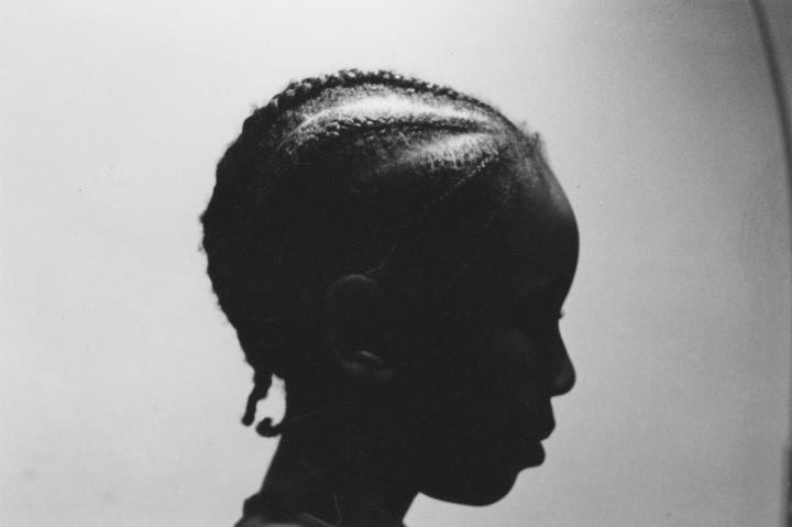 Black and white image of a kids head