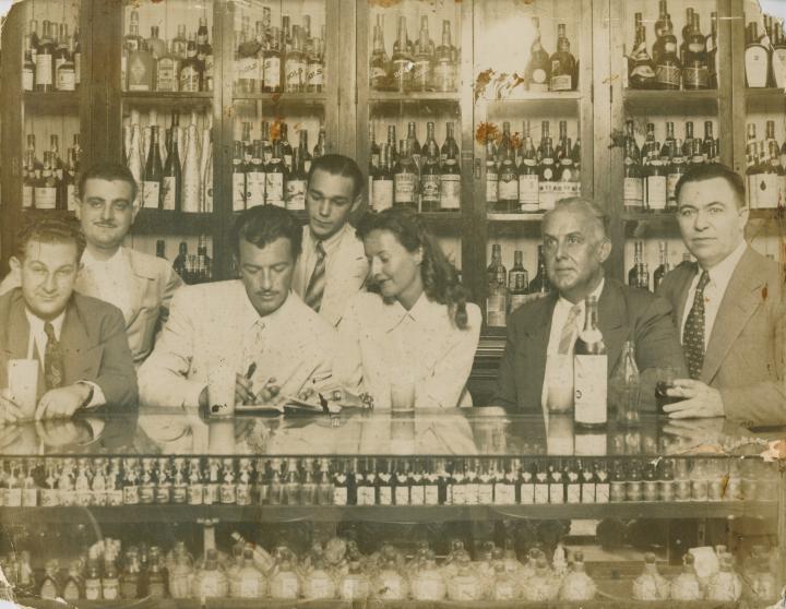 A group of people at a bar.