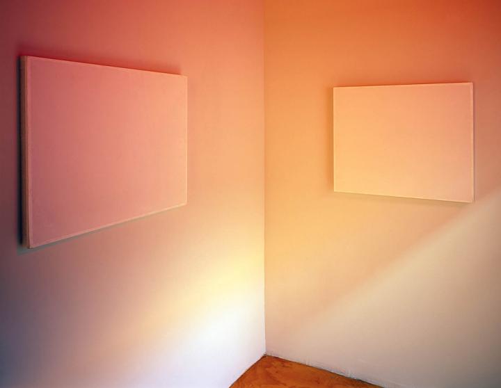 The corner of the room with an orange hue.