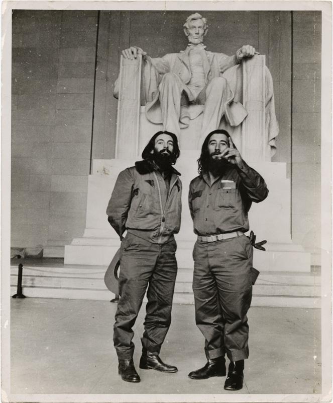 Two man standing in front of the lincoln statue.