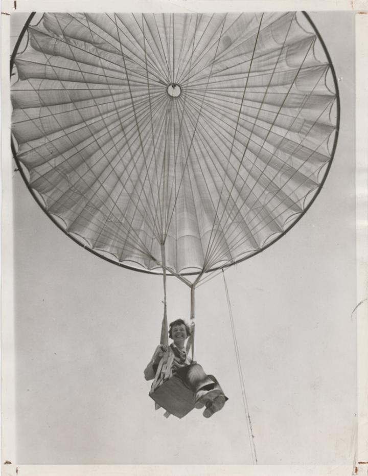 Amelia Earhart descending to Earth in a giant balloon. 