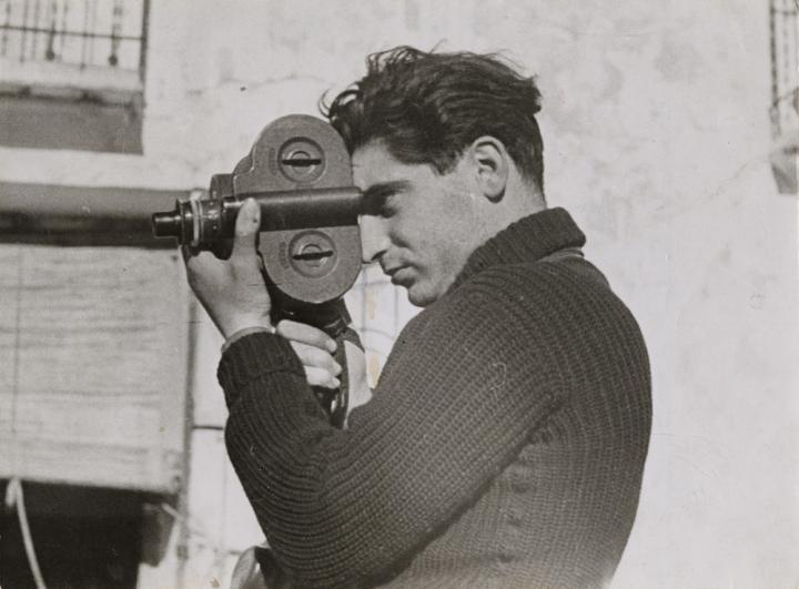 A side profile of Robert Camera using a camera. 